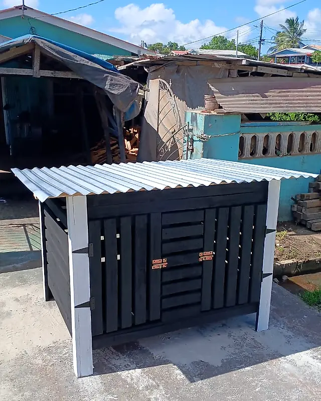 Black bin shelter with white posts and a zinc roof – Lynn's Furniture