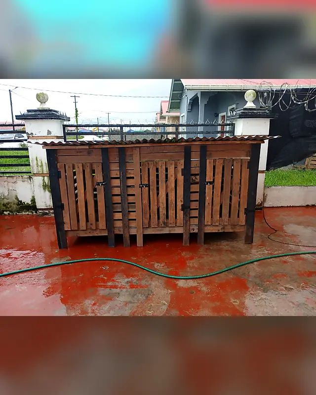 Large wooden bin shelter with three latched doors and a zinc roof – Lynn's Furniture