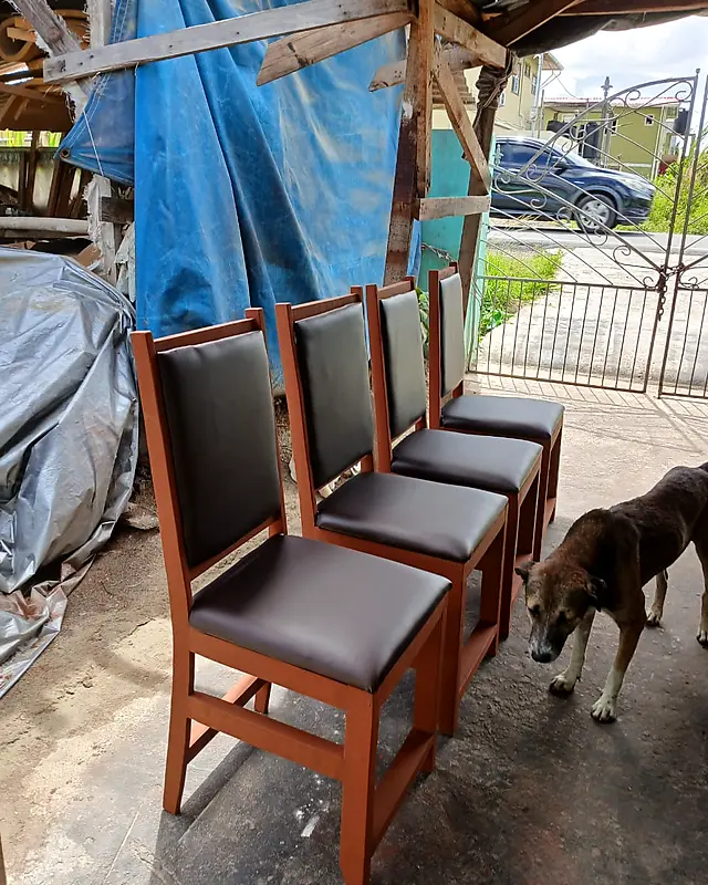 Four light brown dining chairs with dark brown padded seats and backs – Lynn's Furniture
