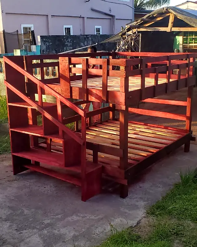 Red-stained wooden bunk bed with a staircase – Lynn's Furniture