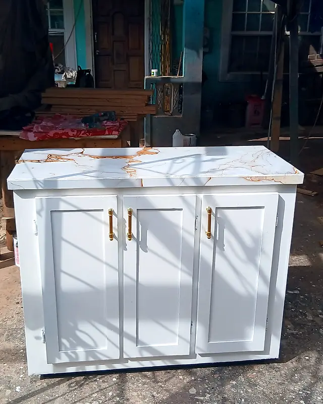White three-door cabinet with a marble-look top and gold handles – Lynn's Furniture