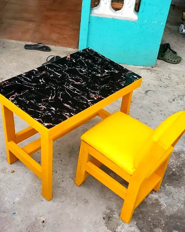 Yellow café table with a black marble-look top and a padded yellow chair – Lynn's Furniture