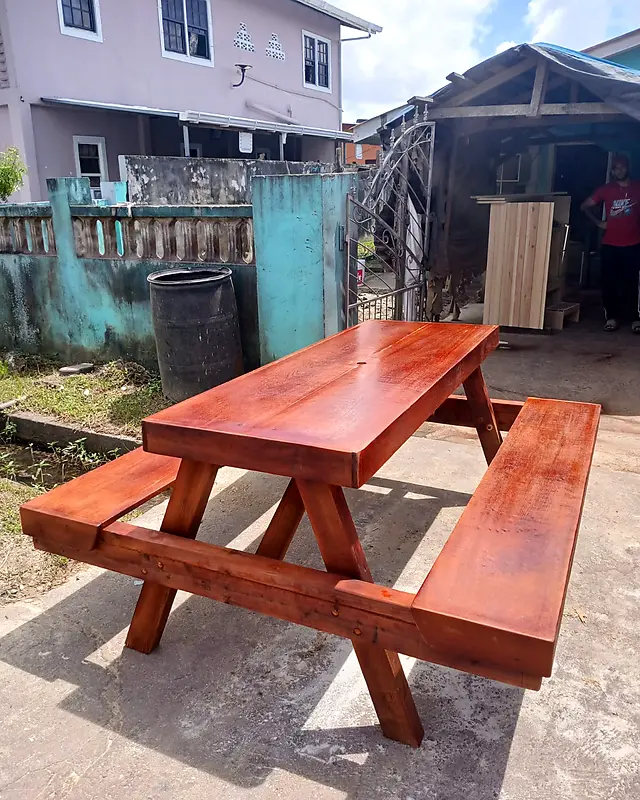 Red-stained wooden picnic table with two attached benches – Lynn's Furniture